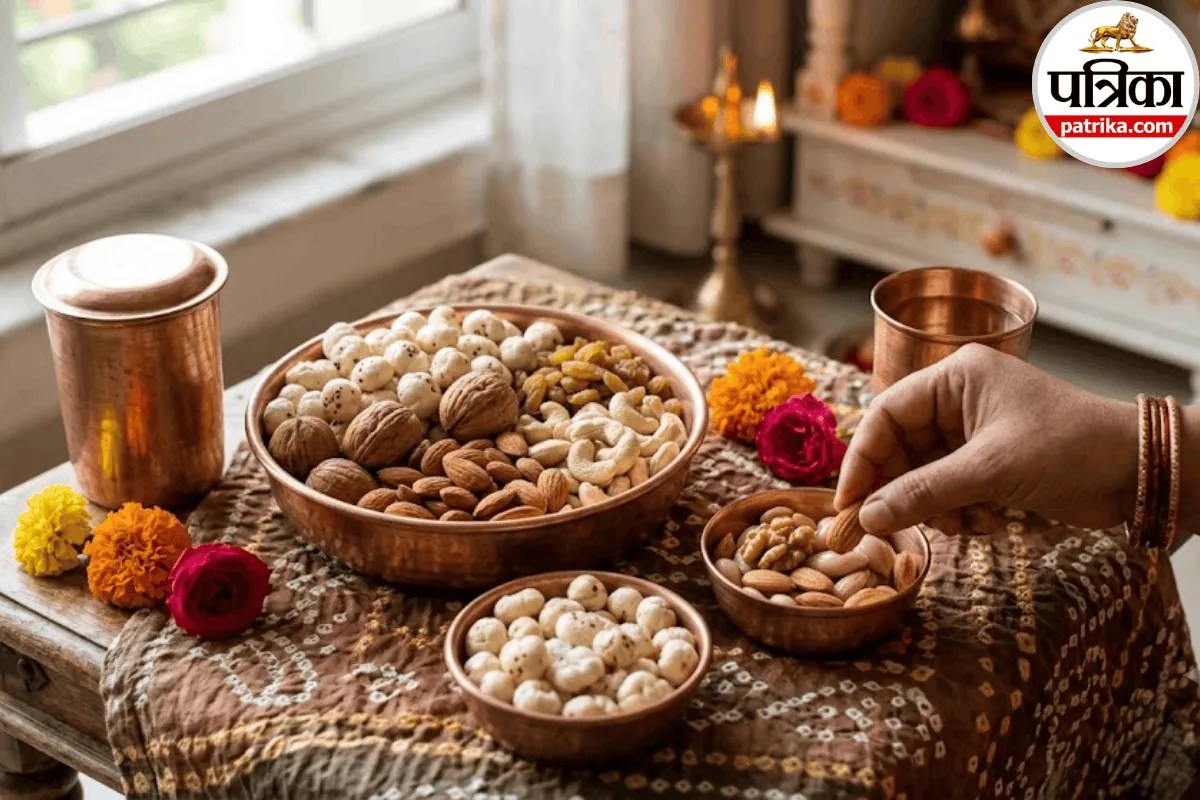 A bowl of mixed dry fruits including almonds, walnuts, and makhana placed on a wooden table