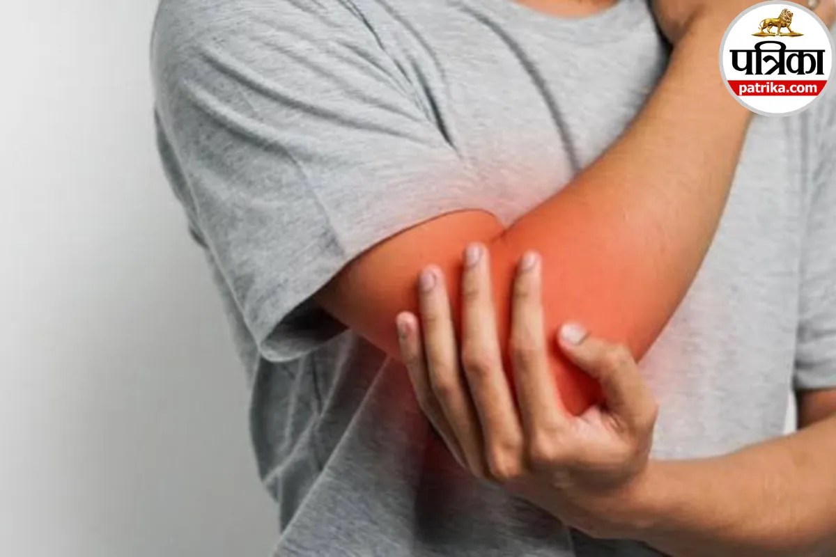 A person holding their elbow in pain
