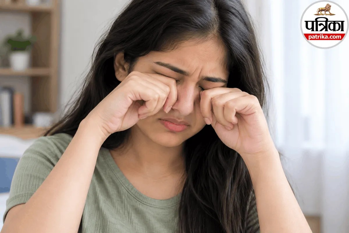 A person gently holding their hand near tired eyes to avoid the dangerous habit of eye rubbing