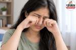 A person gently holding their hand near tired eyes to avoid the dangerous habit of eye rubbing