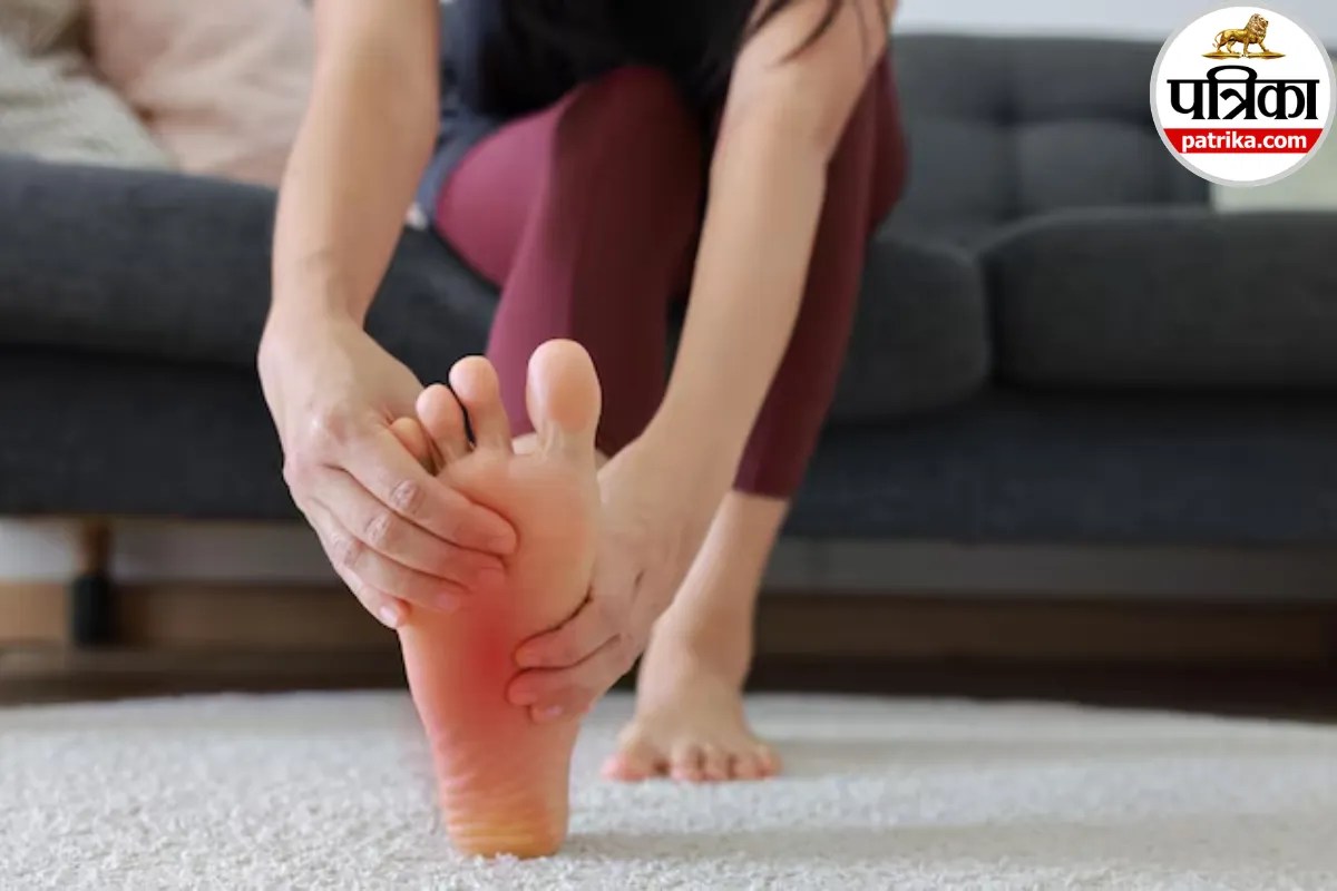 A person experiencing foot numbness and tingling sensation while sitting on a bed
