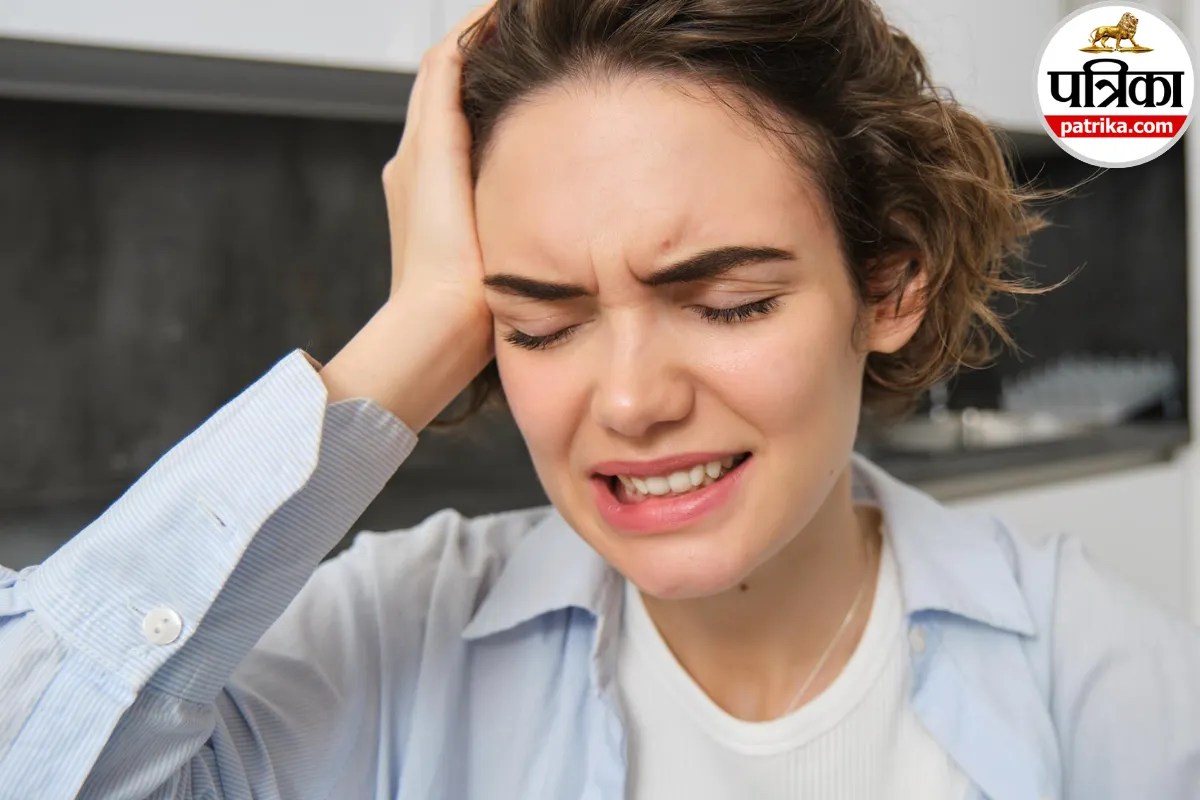 Woman holding head in pain due to migraine during Navratri fasting