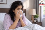 Person sneezing in bed in the morning due to dust mites and morning allergies vs asthma symptoms