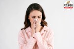 Person suffering from seasonal allergy wiping nose and experiencing watery eyes