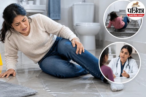 A person holding their back and knee in pain after slipping on a wet bathroom floor