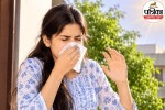 A person sneezing outdoors in bright sunlight, experiencing the photic sneeze reflex