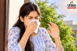 A person sneezing outdoors in bright sunlight, experiencing the photic sneeze reflex