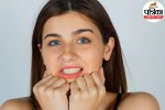 Person waking up in the morning experiencing severe jaw pain and teeth grinding symptoms (bruxism)