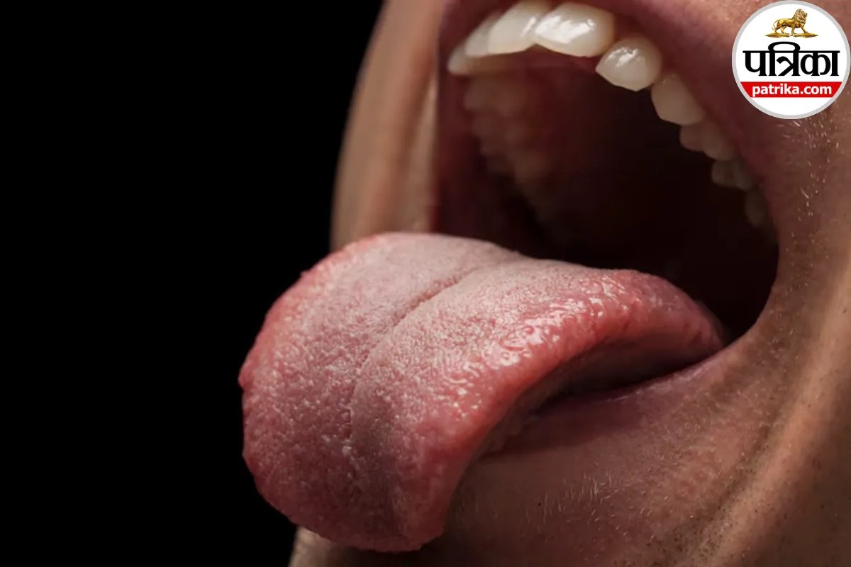 Person checking tongue for signs of liver disease and health issues